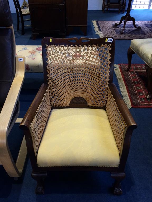 A Bergère armchair with claw and ball feet