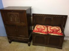 An oak monks bench and an oak cocktail cabinet