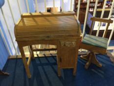 A tambour fronted child's desk and chair