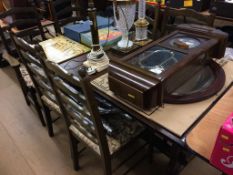 An oak refectory table and six chairs