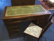 A reproduction mahogany pedestal desk