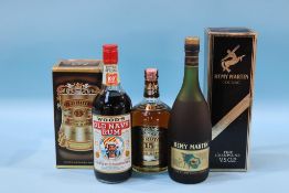 A bottle of Wood's 'Old Navy' rum, a bottle of Old Royal Scotch whiskey and Remy Martin Fine