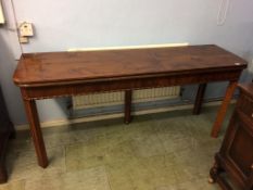 A long walnut fold over table