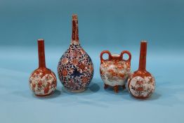 Three Kutani vases and a Japanese Imari bottle vase
