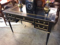 An embossed five drawer writing desk, 117cm length