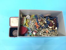 A box of costume jewellery, to include a Victorian meritorious service medal etc.