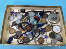 A collection of various silver medals and a pocket watch etc.