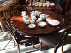 A Victorian style table, with four chairs