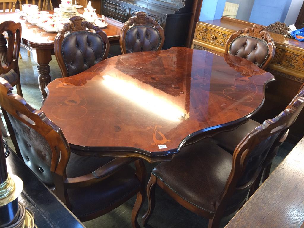 An Italian style dining table and six chairs