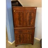 A reproduction mahogany cocktail cabinet