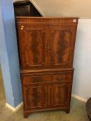 A reproduction mahogany cocktail cabinet