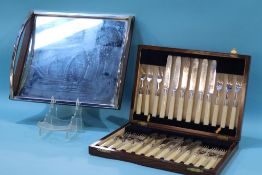 A mirrored tray with chrome handles and rosewood edging, 36cm wide and a canteen of fish knives