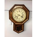 A walnut cased octagonal wall clock, by Ansonia Clock Company, New York