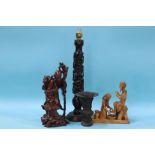 A carved rosewood figural table lamp, a root man figure etc.