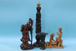 A carved rosewood figural table lamp, a root man figure etc.