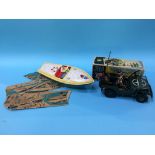 Tin plate toys, an Arnold Jeep and a speed boat