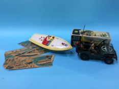 Tin plate toys, an Arnold Jeep and a speed boat