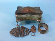 A silver lidded box, silver belt buckle etc.