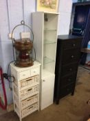 A modern chest of drawers, narrow display cabinet etc.