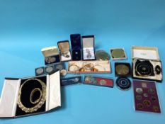 A quantity of costume jewellery, compacts etc.