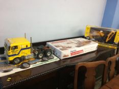 A Tamiya Globeliner remote control truck, a boxed King of the Mississippi and a boxed remote control