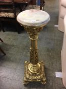 A gilt pedestal, with onyx top