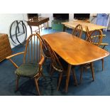 An elm Ercol table and six chairs