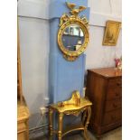 A Regency style gilt circular mirror with bevelled glass, with console table and wall bracket, (