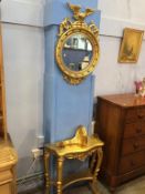 A Regency style gilt circular mirror with bevelled glass, with console table and wall bracket, (