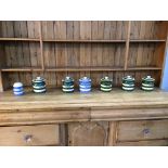 Five T. and G. Green Cloverleaf storage jars and two pieces of Cornish ware