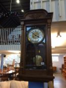 A walnut cased eight day wall clock