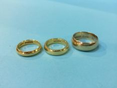 Two 22ct gold rings, 15.7g and a 9ct gold ring, 7.4g