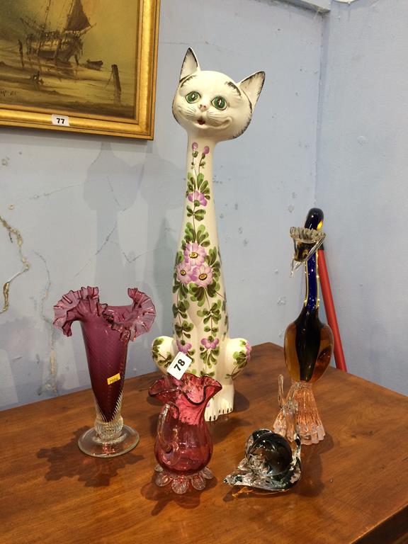A tall Italian cat figure and a selection of glassware