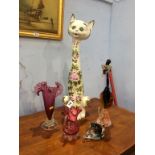 A tall Italian cat figure and a selection of glassware