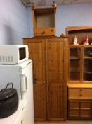 A pine double door wardrobe and bedside chest