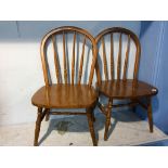 A pair of Children's stick back chairs