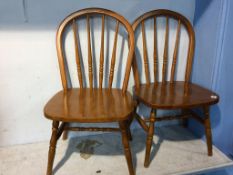 A pair of Children's stick back chairs