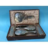 A cased silver backed vanity set