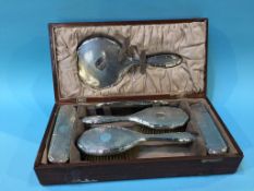 A cased silver backed vanity set