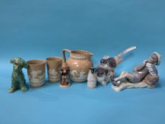 Two Lladro figures, a Hummel figure and a water jug and two beakers etc.