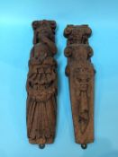 A pair of carved wood relief corbels, 41cm length