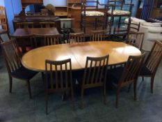 A teak G Plan extending table and nine chairs