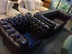 A brown leather Chesterfield three seater sofa and matching Club chair