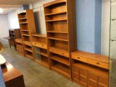 A run of Nathan teak bookcases