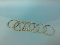 Seven 9ct gold bangles, 32.5g