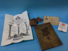 A trio of unnamed medals, and assorted ephemera, to include a German medical note "Findings of the