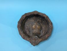 A heavy brass lion mask door knocker, 25cm diameter