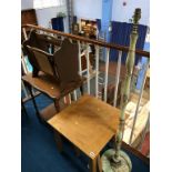 An oak occasional table, magazine rack and a part nest of tables and a lamp