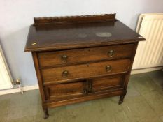 An oak chest of drawers