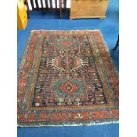 A Persian rug, 76" x 59"